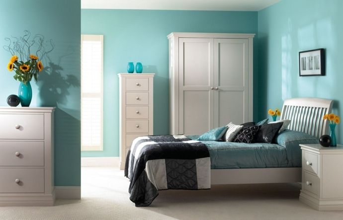 Bed decoration pillows cloakroom wardrobe chest of drawers side table white blue green feng shui in the bedroom