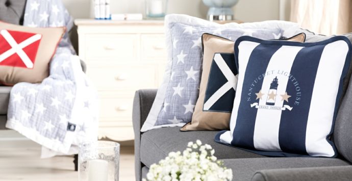 Decorative pillows for the living room design in a maritime furnishing style
