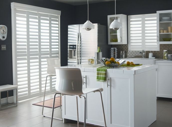 Wooden blinds in white kitchen curtains