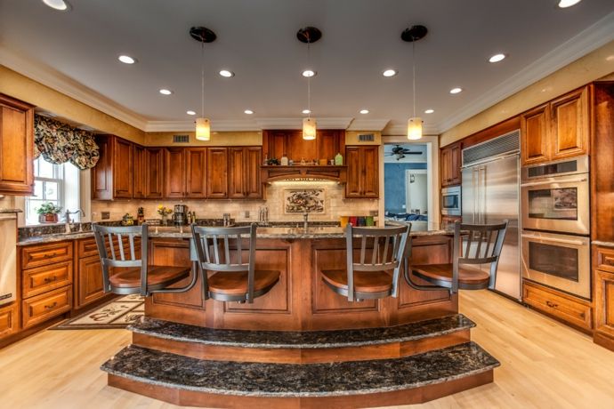 Modern, luxurious kitchen made of granite and wood in a maritime style