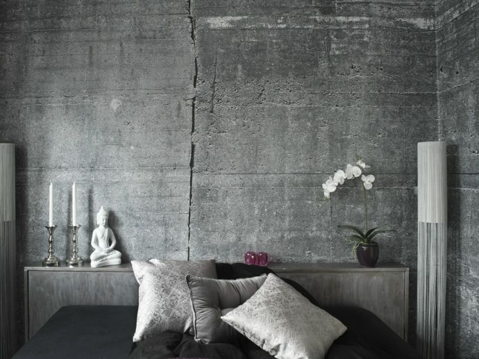 Bedroom stylish decorative pillow orchid floor lamp Buddha figure candle holder silver white wallpaper in concrete look industrial style