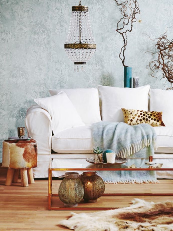 White sofa with a cozy blanket in baby blue-new romance