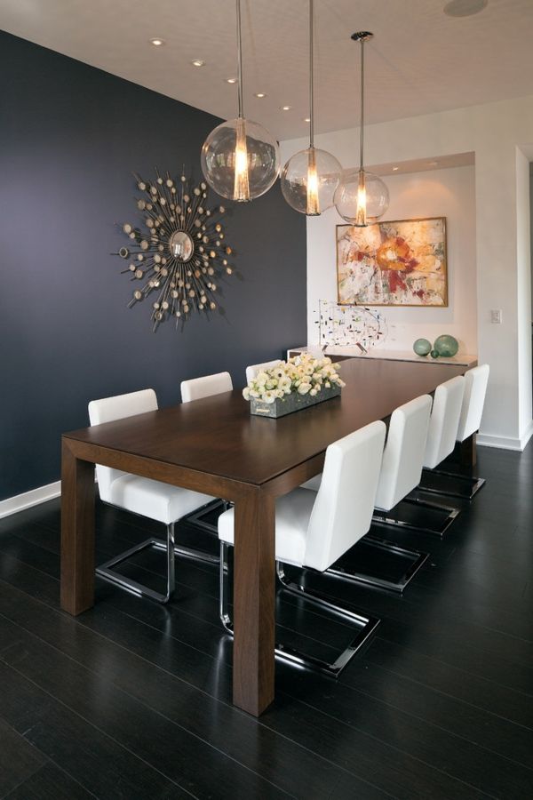 Accent wall in black with contemporary wall mirror wall design in the dining room