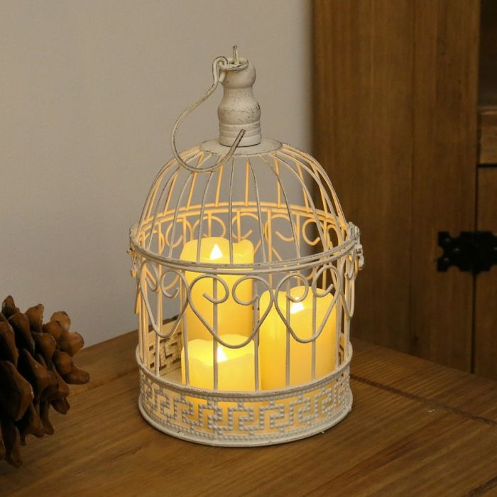 Create cosiness in retro style with candles - birdcage stick candles, romantic lighting mood