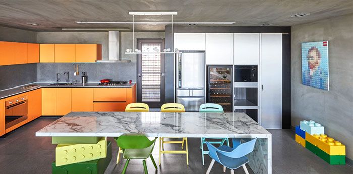 The kitchen with contrasting colors looks friendly and inviting-unique designer apartment kitchen wall shelves in orange concrete wall