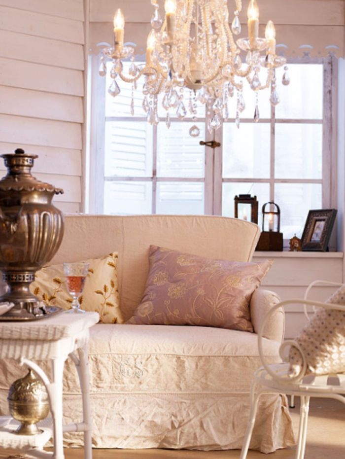 Elegant furnishings, chandeliers, decorative pillows, interior design in vintage and shabby chic