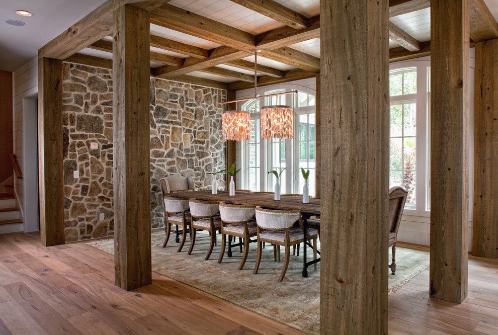 Exotic design with stone wall and sturdy wooden beam stone look stone wall interior design wooden beam cottage cottage dining room