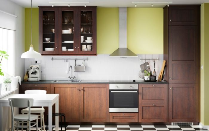 Ikea kitchen system in brown kitchen shelves with glass doors