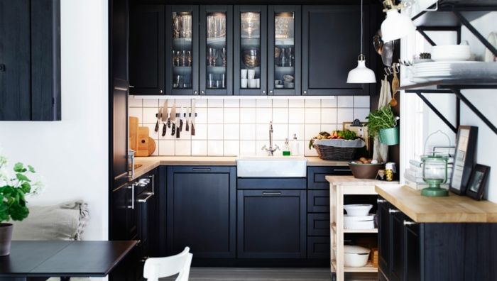 Ikea kitchen system in black kitchen shelves with glass doors