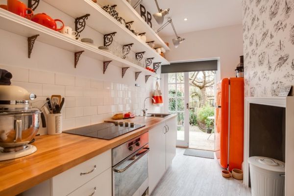 Small kitchen in warm colors-American fridge in orange