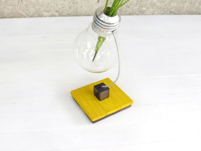 Small vase in black and yellow office designer decoration