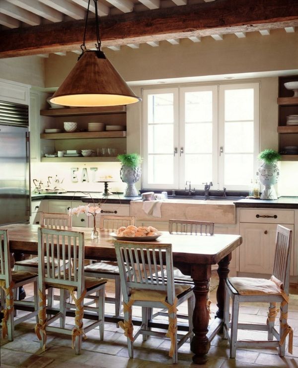 Country kitchen with playful elements-solid wood table, kitchen chairs with chopsticks, rustic shabby chic