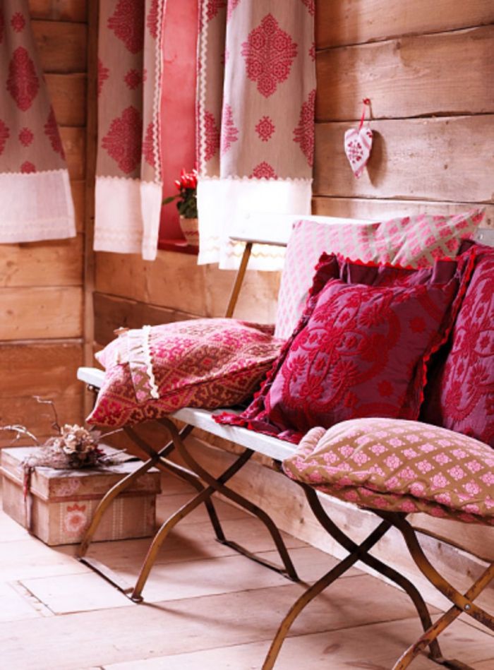 Country style shabby chic furnishings, decorative pillows interior design in vintage and shabby chic
