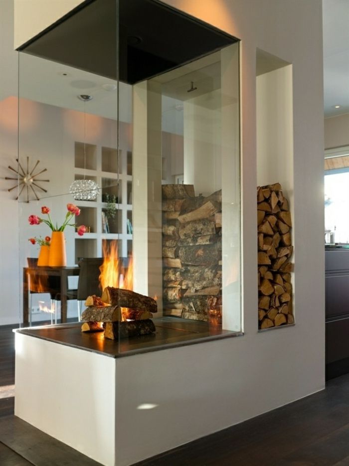 Modern panorama fireplace with wood compartment for a unique living ambience - wood storage Firewood storage