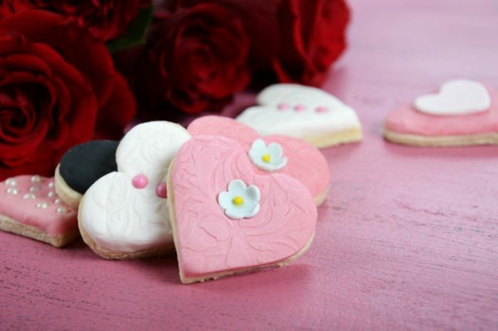 Heart shaped dessert cookies with frosting heart shaped pink fondant Valentine's Day