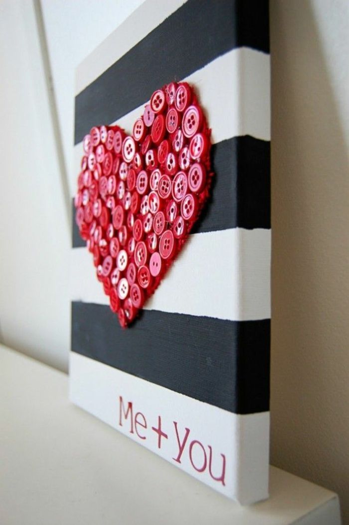 Red heart made of buttons black and white stripes on canvas decoration ideas for Valentine's Day