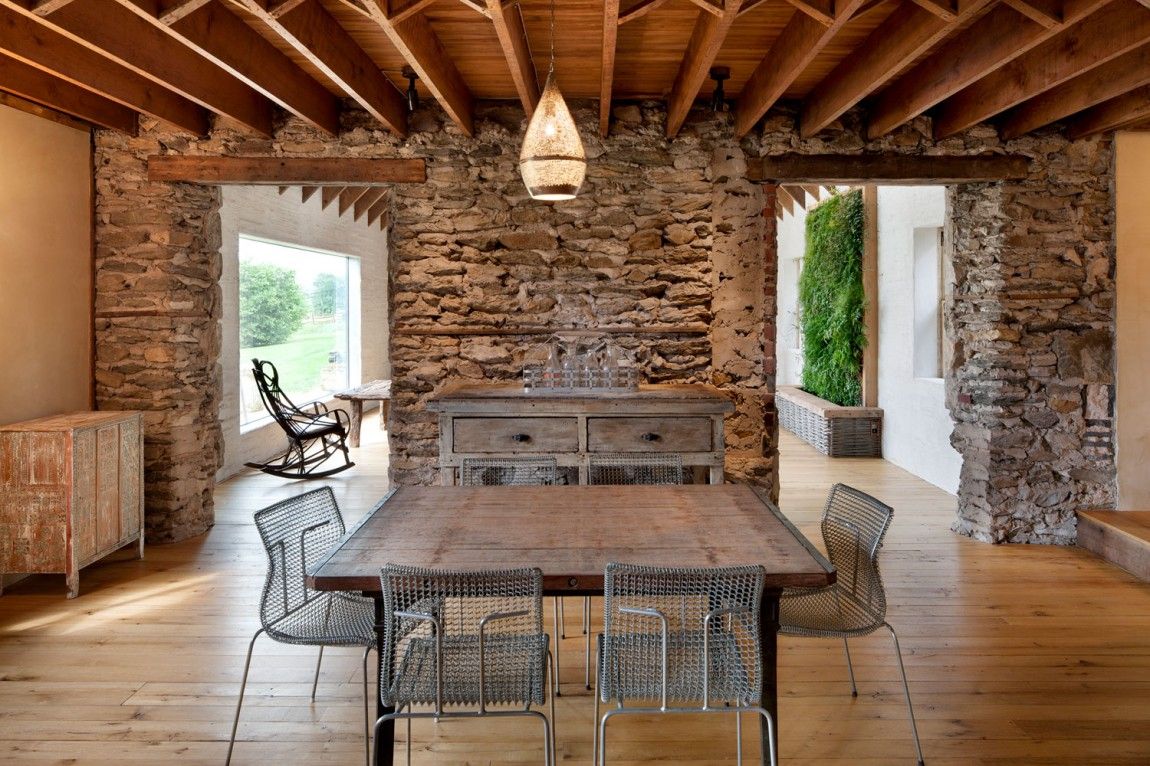 Rustic furnishings with a nostalgic look stone wall, interior design, dining area, rustic ceiling beams