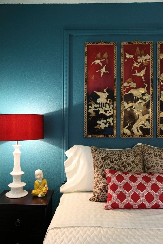 Bedroom in red and teal oriental lamps