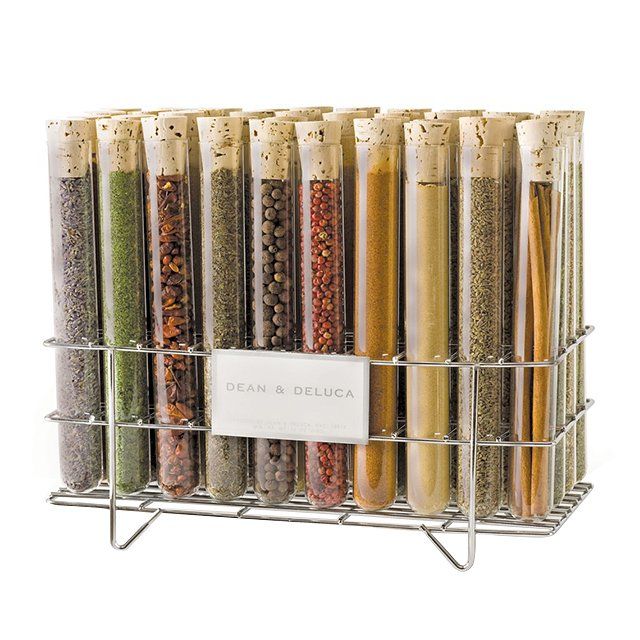 Sleek spice container set offers functionality and a designer glass container spice rack