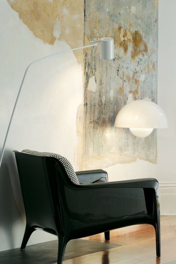 Armchair in black interior with industrial furniture