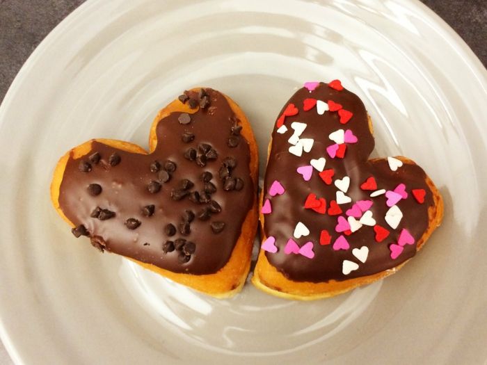 Sweet donut hearts with chocolate icing and chocolate sprinkles dessert heart shape Valentine's day donuts homemade