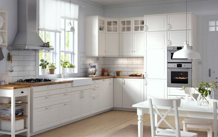 Traditional kitchen cabinets on white kitchen shelves with glass doors