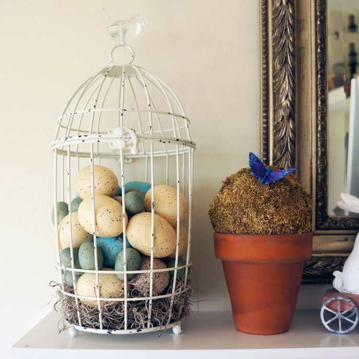 Birdcage as decoration for Easter-White birdcage retro decoration ideas fireplace console Easter Easter
