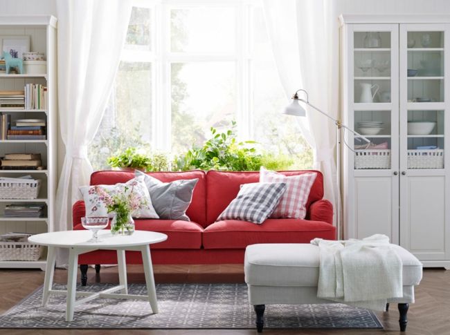 Living room, red armchair, white side table, white closet-living room ideas