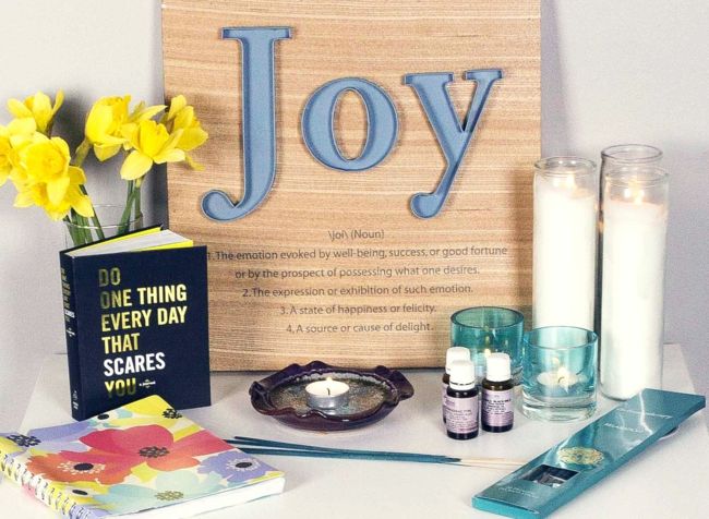 Yoga, candles, aromatic oil, book, flowers, yoga altar