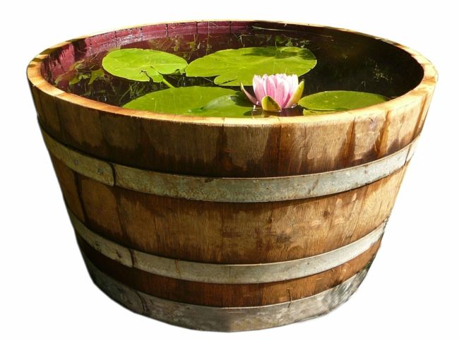 use old wine barrels as garden decorations garden decoration ideas