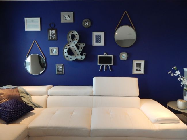 blue wall, white couch, wall decor-living room ideas