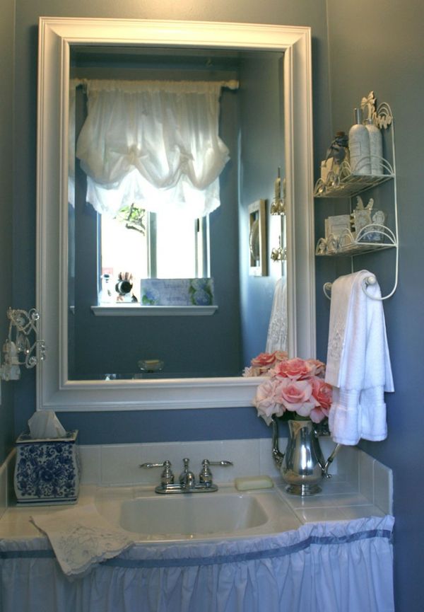 The wall color of this bathroom is a hit vintage bathroom