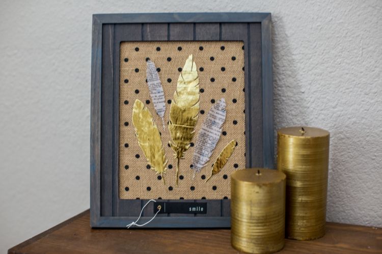 Feather in picture frame as a living accessory
