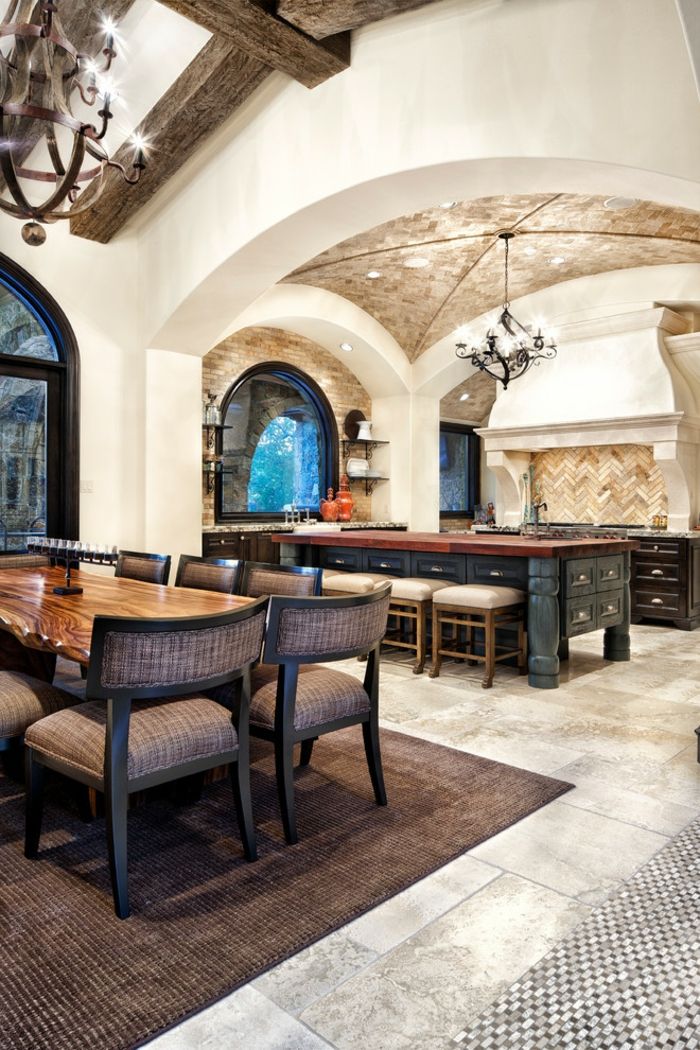Spacious Mediterranean kitchen with white walls and round stone ceiling designer luxury kitchen texture contrast