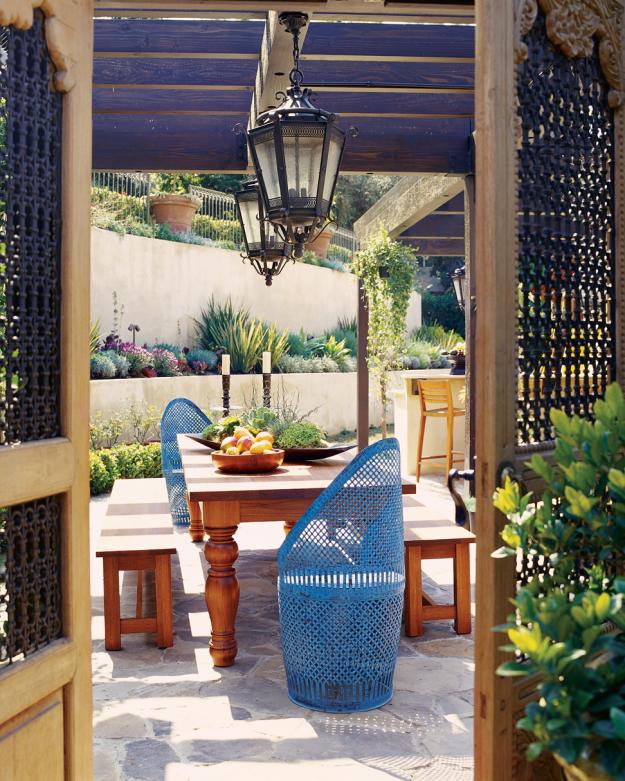 Creativity in the yard design with beach chairs and lantern-eclectic garden furniture