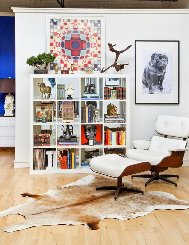 Reading corner with cowhide rug-eclectic patchwork bookshelf