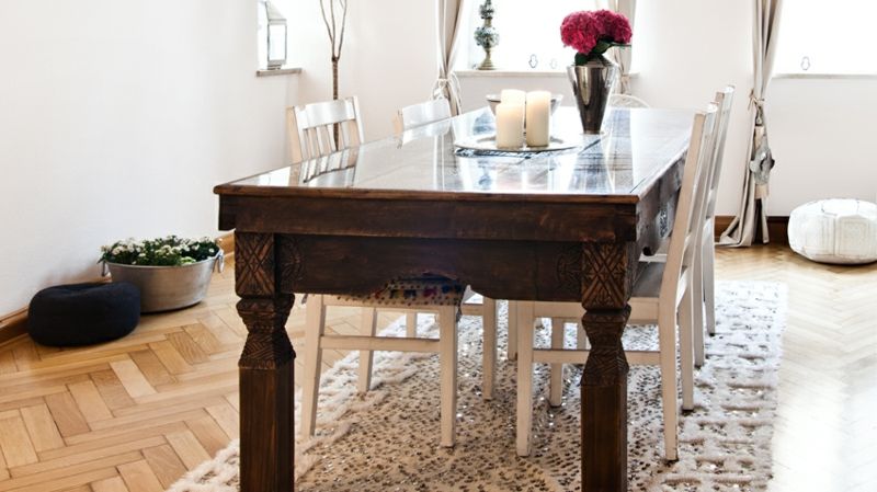 Solid wood table and white chairs-boho style feminine textiles