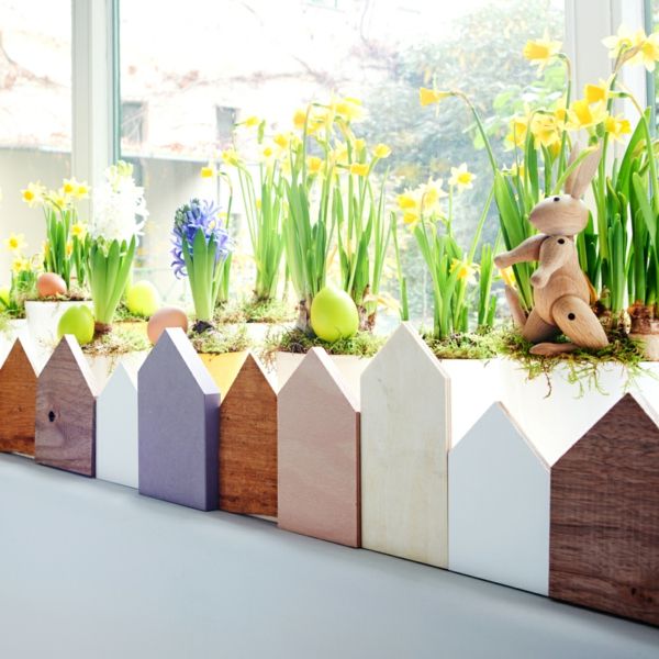 Easter decoration little house window sill spring flowers