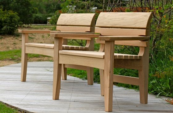 Robust wooden benches with wooden backrests