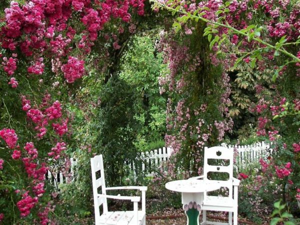 The scent of roses fills the small romantic garden