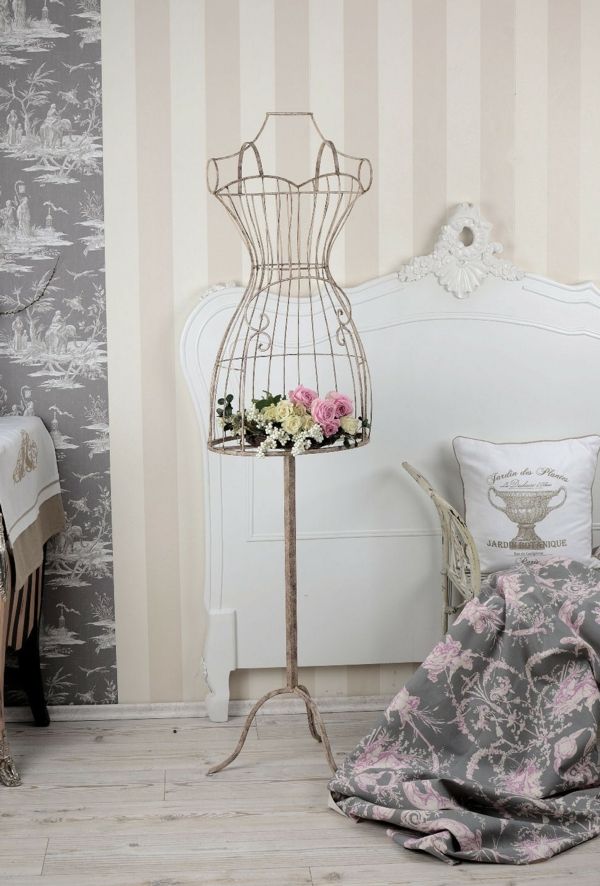 Stylish metal tailor bust decorating home accessories with fresh flowers