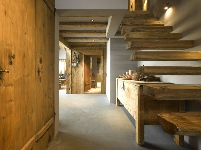 Doors, beams, stairs, built-in and free-standing furniture are rustic