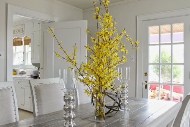 Arrange glass vases with spring flowers