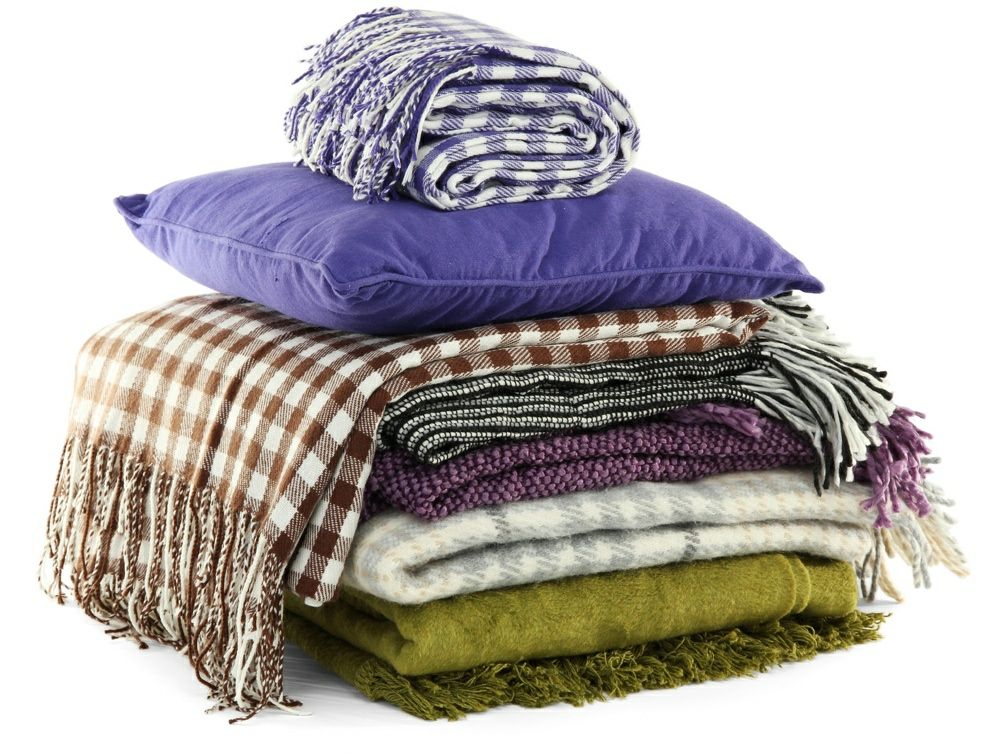 Textiles outside picnic blanket pillows
