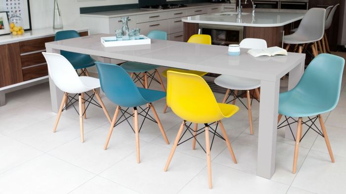 Colorful chairs provide variety around the dining table