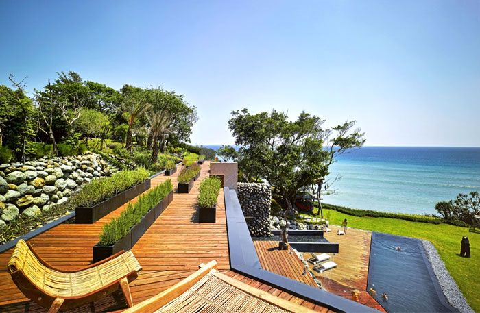 Design house living idea nature stone wood pacific ocean roof terrace deck chair