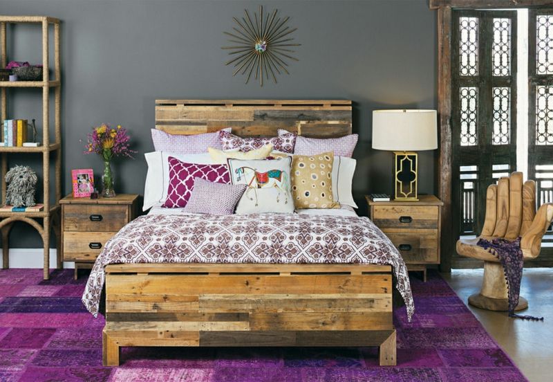Colors and patterns harmonize with the wooden furniture in this bedroom