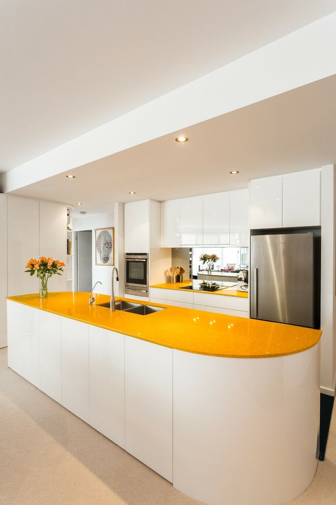 Kitchen furnishings curvy island white sunny yellow smooth