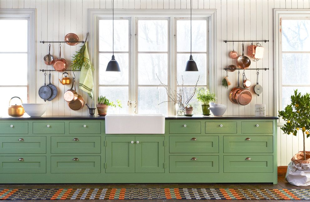 Kitchen interior design green kitchen cabinet hanging lamp copper dishes