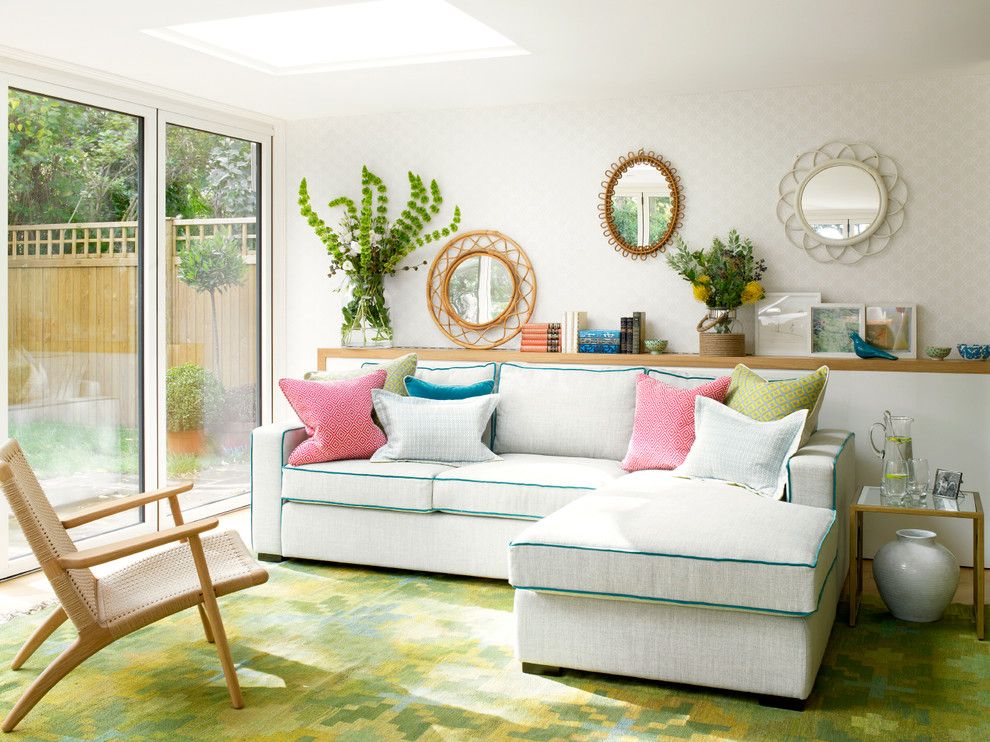A sofa makes the room more comfortable, a few decorative pillows on it - even more